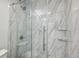 Close up of modern shower with marble design and glass door at 1255 Branch Dr, Tucker, GA 30084