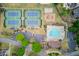 Aerial view showcases community amenities including tennis courts, a pool, and a playground for recreation at 1343 Riverview Run Ln, Suwanee, GA 30024