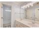Bathroom with double sinks, tile flooring, and shower-tub combination at 1343 Riverview Run Ln, Suwanee, GA 30024