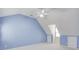 Bedroom with sloped ceilings, carpet, and blue accent walls at 1343 Riverview Run Ln, Suwanee, GA 30024