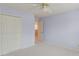 Bedroom with neutral carpet and a closet with white painted doors at 1343 Riverview Run Ln, Suwanee, GA 30024