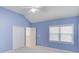 Bedroom with blue walls, a ceiling fan, carpet, and a closet at 1343 Riverview Run Ln, Suwanee, GA 30024