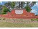 Entrance to Chattahoochee Run with brick signage surrounded by lush landscaping at 1343 Riverview Run Ln, Suwanee, GA 30024