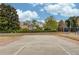 Community sports court with fencing and nearby playground at 1343 Riverview Run Ln, Suwanee, GA 30024