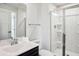 Modern bathroom features a shower with glass door and a sleek vanity with sink at 156 Marchmont Dr, Locust Grove, GA 30248