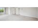 Generous bedroom showing neutral carpet and paint, and multiple entry doors at 156 Marchmont Dr, Locust Grove, GA 30248
