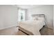 Comfortable bedroom with soft lighting, plush bedding, and a serene ambiance at 156 Marchmont Dr, Locust Grove, GA 30248