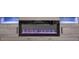 Contemporary fireplace features a sleek design and ambient lighting for a modern touch at 156 Marchmont Dr, Locust Grove, GA 30248