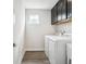 Well-organized laundry room with modern appliances and dark cabinets for ample storage at 156 Marchmont Dr, Locust Grove, GA 30248