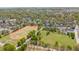 An aerial view showcasing the neighborhood, track, and surrounding lush green trees at 770 Reed Se St, Atlanta, GA 30315