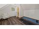 Finished attic with chair, hardwood floors, and ensuite bath at 770 Reed Se St, Atlanta, GA 30315