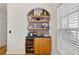 Built in bar with shelving, beverage cooler, and custom lighting at 770 Reed Se St, Atlanta, GA 30315