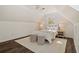 Bright bedroom featuring neutral colors, wood floors, and cozy overhead lighting at 770 Reed Se St, Atlanta, GA 30315
