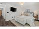 Cozy bedroom featuring hardwood floors, TV, overhead lighting, and stylish décor at 770 Reed Se St, Atlanta, GA 30315