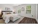Cozy bedroom with natural light, wood floors, and neutral decor at 770 Reed Se St, Atlanta, GA 30315