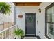 Welcoming front porch featuring a stylish door with a wreath and potted plants at 770 Reed Se St, Atlanta, GA 30315