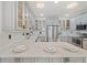 This spacious kitchen features gray cabinets, stainless appliances, and quartz countertops at 770 Reed Se St, Atlanta, GA 30315