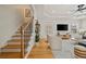 Open floor plan boasts a living room with hardwood floors and a staircase with iron railings at 770 Reed Se St, Atlanta, GA 30315