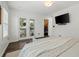 Relaxing main bedroom featuring hardwood floors, french doors, and a walk-in closet at 770 Reed Se St, Atlanta, GA 30315