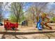 Community playground featuring colorful play structures, slides, and a fire truck for imaginative play at 770 Reed Se St, Atlanta, GA 30315