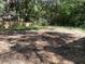 Spacious backyard with mature trees and partial fencing at 8154 Tudor Dr, Jonesboro, GA 30238
