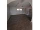 Unfinished basement with updated flooring and a window at 8154 Tudor Dr, Jonesboro, GA 30238