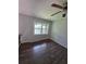 Bedroom with hardwood floors and a large window at 8154 Tudor Dr, Jonesboro, GA 30238
