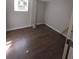 Bedroom with hardwood floors and a window at 8154 Tudor Dr, Jonesboro, GA 30238