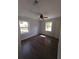Bedroom with hardwood floors, windows, and a closet for storage at 8154 Tudor Dr, Jonesboro, GA 30238