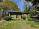Two-story home with a cozy front yard and mature trees providing ample shade at 8154 Tudor Dr, Jonesboro, GA 30238