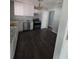 Bright kitchen featuring new appliances, white cabinetry, and granite countertops at 8154 Tudor Dr, Jonesboro, GA 30238