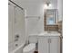 Well-lit bathroom featuring a shower-tub combination and a white vanity at 1077 Mainstreet Valley Dr, Stone Mountain, GA 30088