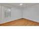 Bright bedroom with hardwood floors and a window providing natural light at 1077 Mainstreet Valley Dr, Stone Mountain, GA 30088