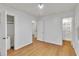 Spacious bedroom featuring a closet, wood-look floors, and a bright interior at 1077 Mainstreet Valley Dr, Stone Mountain, GA 30088