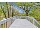 Spacious outdoor deck overlooking lush greenery, providing an ideal space for relaxing or entertaining guests at 1077 Mainstreet Valley Dr, Stone Mountain, GA 30088