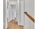 Hallway with wood-look floors and white walls at 1077 Mainstreet Valley Dr, Stone Mountain, GA 30088