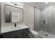Contemporary bathroom featuring a walk-in shower, a large mirror, and modern fixtures at 1688 Mineral Springs Rd, Hoschton, GA 30548