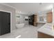 Elegant bathroom with a soaking tub, walk-in shower, and a double vanity with marble countertops at 1688 Mineral Springs Rd, Hoschton, GA 30548