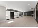 Upper bonus room featuring hardwood floors, glass railings, modern ceiling accents and an open floor plan at 1688 Mineral Springs Rd, Hoschton, GA 30548