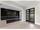 Bonus room with custom cabinetry, shelving and black marble tiled accent at 1688 Mineral Springs Rd, Hoschton, GA 30548