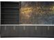 Close-up of stylish custom built-in shelves with a contrasting gold design at 1688 Mineral Springs Rd, Hoschton, GA 30548