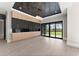 Dining area features custom cabinets, modern lighting, and glass doors offering outdoor views at 1688 Mineral Springs Rd, Hoschton, GA 30548