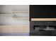 Close-up of a modern fireplace with custom shelving and sleek cabinetry for storage at 1688 Mineral Springs Rd, Hoschton, GA 30548