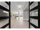 Open foyer with wood flooring, an open floor plan, and a view of the kitchen and great room at 1688 Mineral Springs Rd, Hoschton, GA 30548