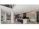 Open kitchen with stainless steel appliances, marble countertops, black kitchen island and hardwood floors at 1688 Mineral Springs Rd, Hoschton, GA 30548