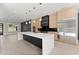 Bright kitchen with stainless steel appliances, modern cabinets, and large center island at 1688 Mineral Springs Rd, Hoschton, GA 30548