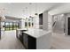 Spacious open kitchen featuring a large island, modern appliances, and an abundance of natural light at 1688 Mineral Springs Rd, Hoschton, GA 30548