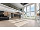 Open concept living room with high ceilings, large windows, and modern finishes at 1688 Mineral Springs Rd, Hoschton, GA 30548