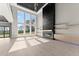 Bright living room with high ceilings, large windows and a modern fireplace at 1688 Mineral Springs Rd, Hoschton, GA 30548