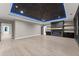 Spacious living room with fireplace and blue LED accent lighting at 1688 Mineral Springs Rd, Hoschton, GA 30548